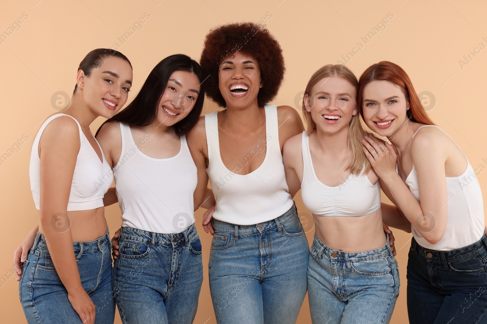 Photo of Group of beautiful young women on beige background