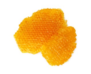 Pieces of natural honeycomb with tasty honey isolated on white, top view