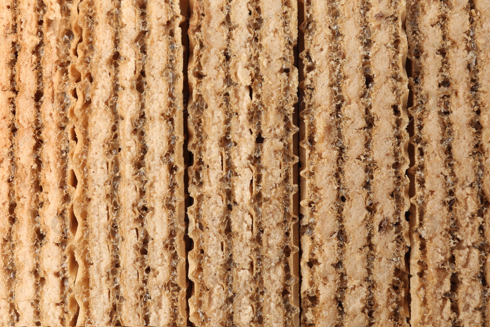 Photo of Closeup view of tasty wafer sticks as background. Sweet food