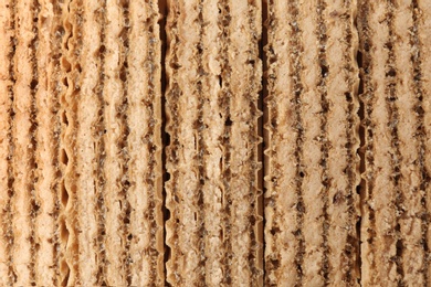 Photo of Closeup view of tasty wafer sticks as background. Sweet food