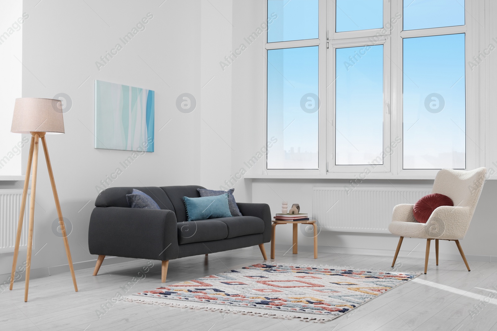 Photo of Living room with beautiful carpet and furniture