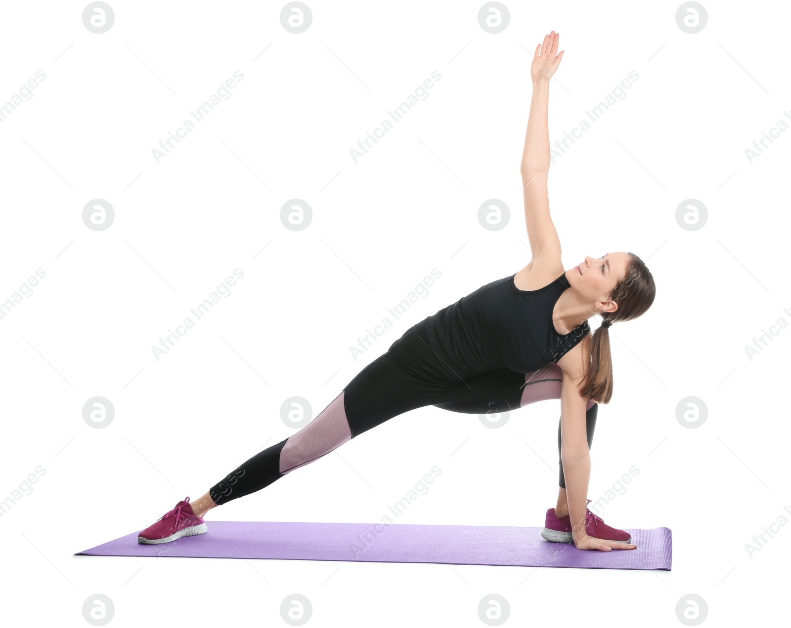 Photo of Young woman doing sports exercises isolated on white. Home fitness