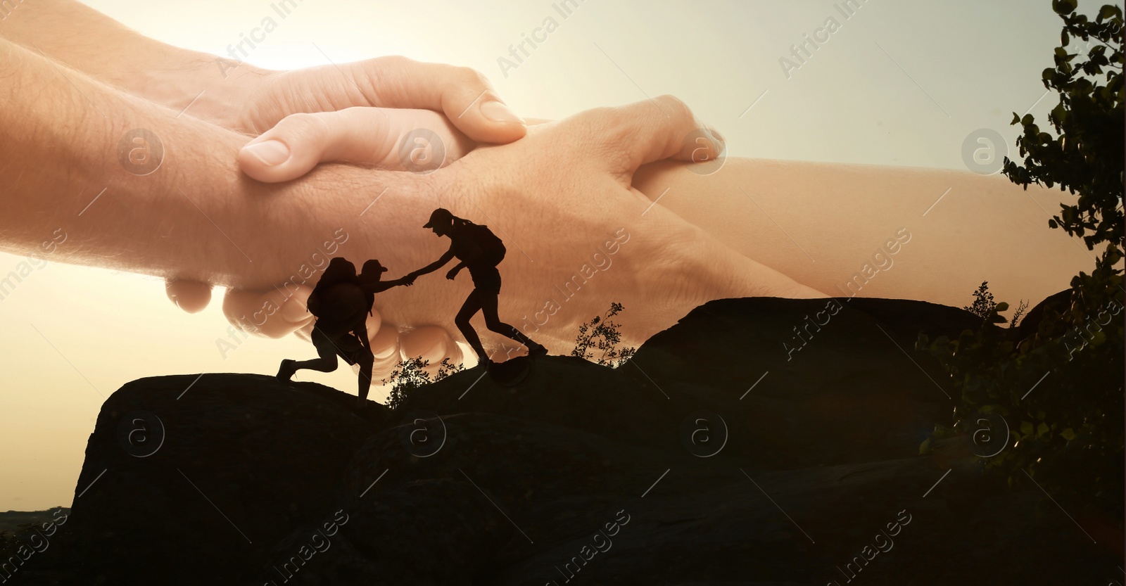 Image of Double exposure of people climbing up mountain and helping hand
