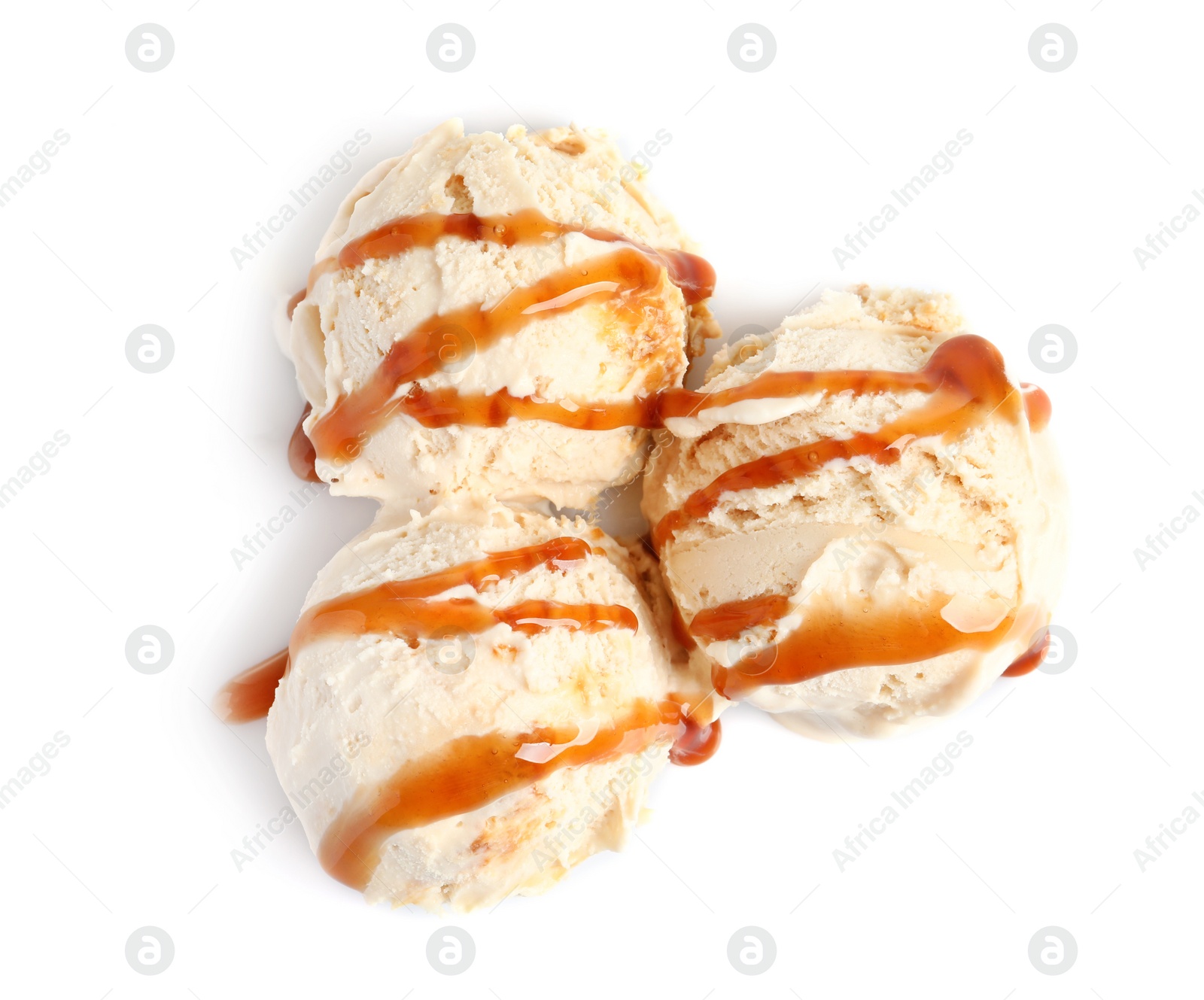 Photo of Tasty ice cream with caramel sauce on white background