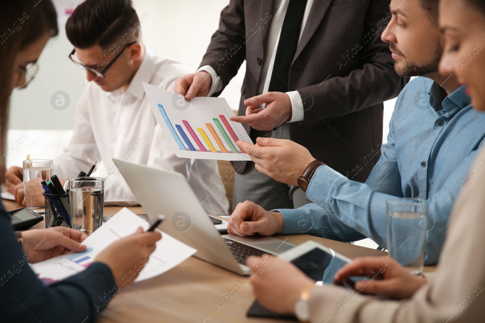 Photo of Businesspeople having meeting in office, closeup. Management consulting