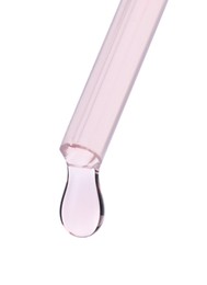 Photo of Dripping liquid from pipette on white background, closeup