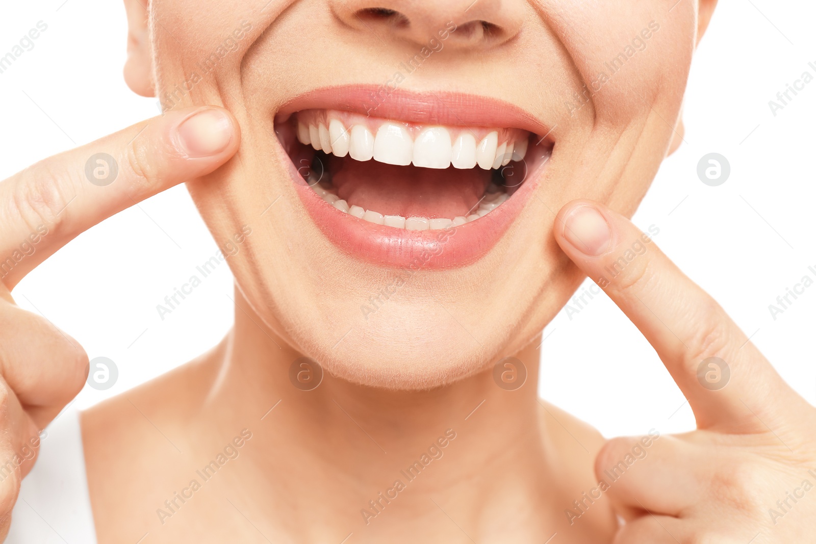 Photo of Young woman with beautiful smile on white background, closeup. Teeth whitening