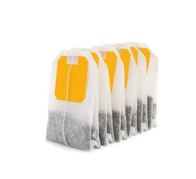 Many new tea bags on white background
