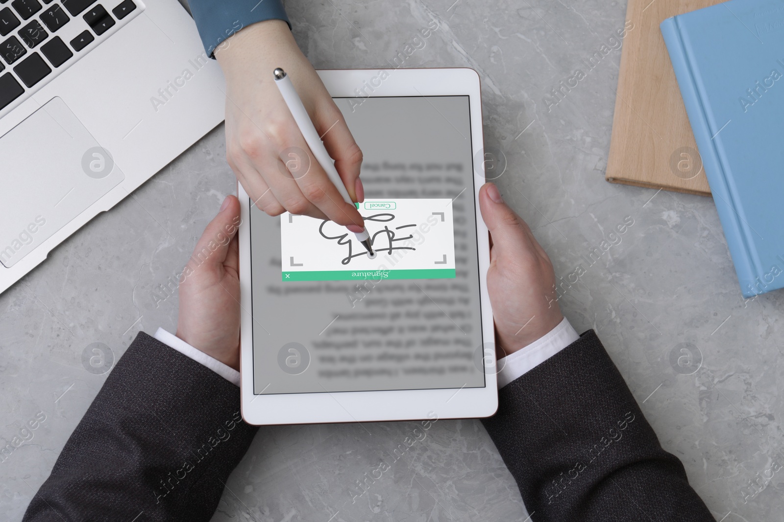 Image of Electronic signature. Woman using stylus and tablet at table, top view