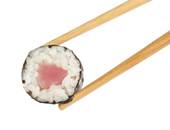 Photo of Chopsticks with tasty fresh sushi roll isolated on white