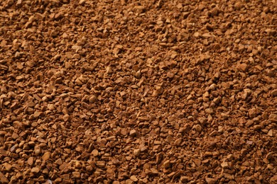 Photo of Aromatic instant coffee as background, closeup view