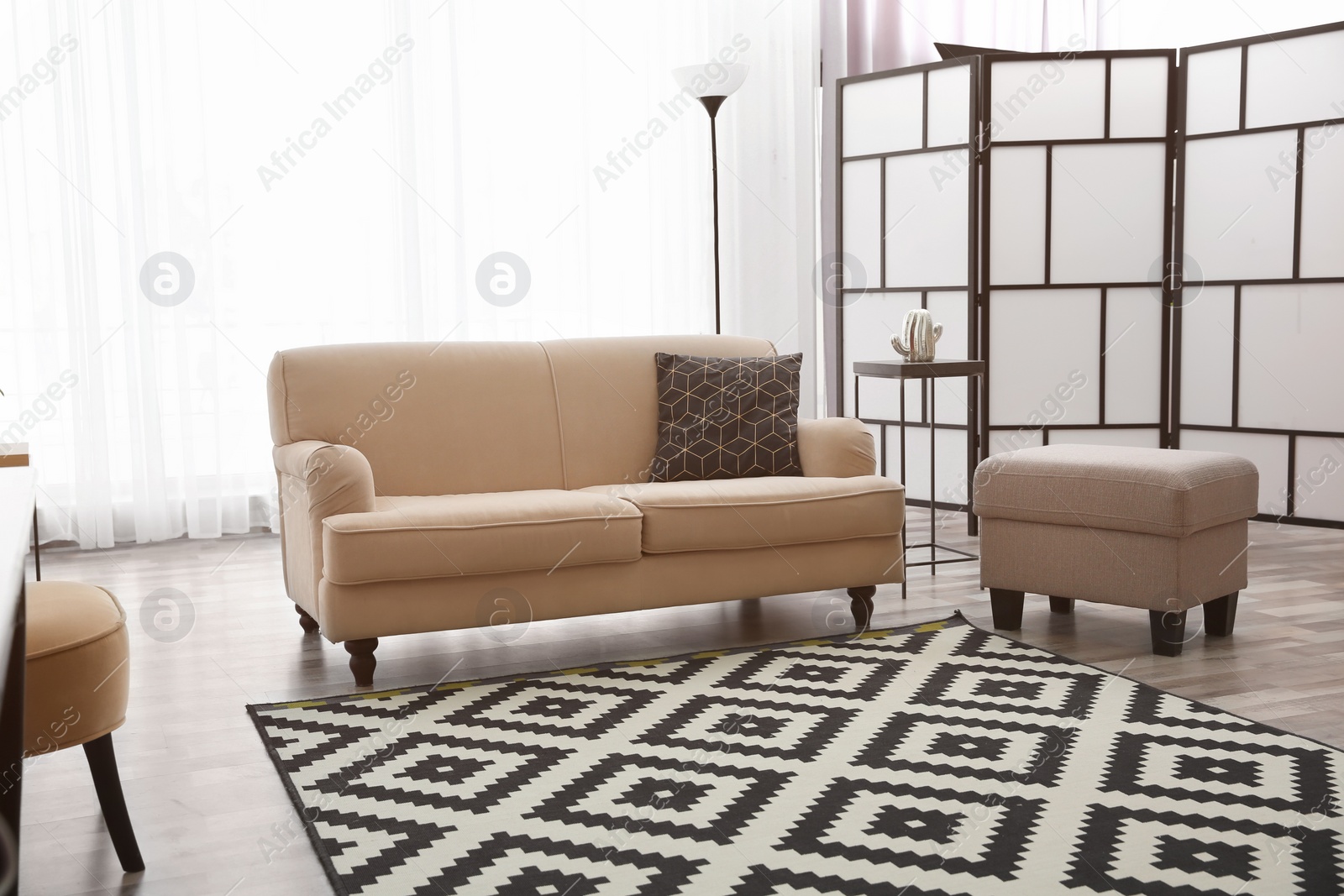 Photo of Modern living room interior with comfortable sofa and beautiful carpet