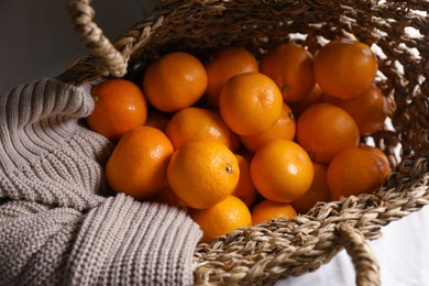 Photo of Net bag with many fresh ripe tangerines, top view