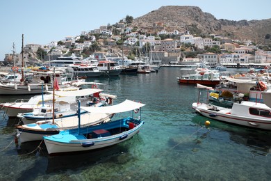 Photo of Beautiful view of coastal city with different boats on sunny day