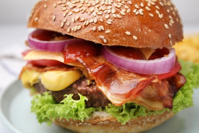 Photo of Delicious burger with bacon, patty and vegetables on plate, closeup