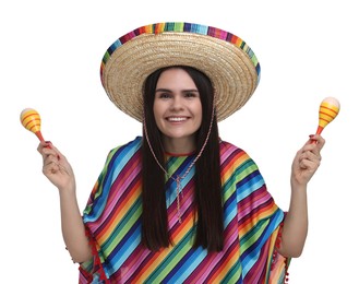 Young woman in Mexican sombrero hat and poncho with maracas on white background