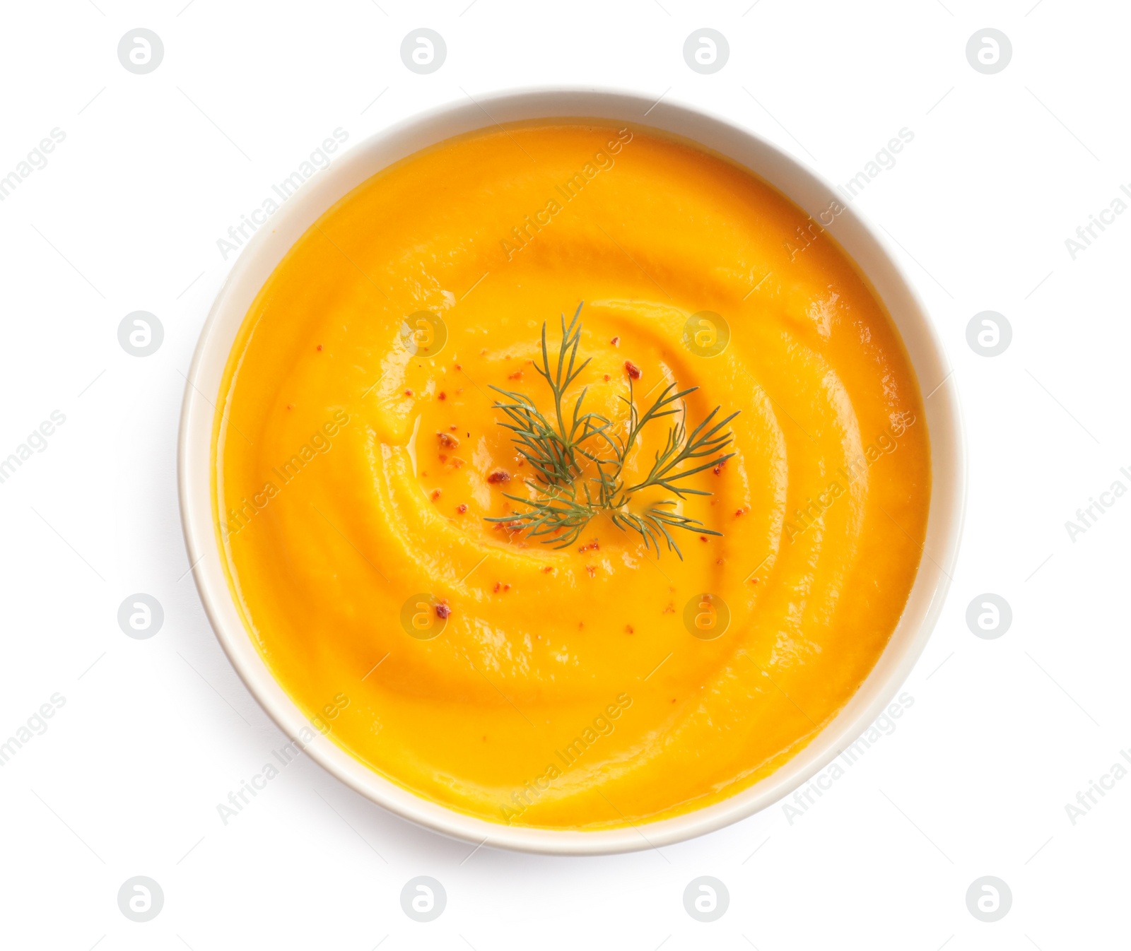 Photo of Delicious pumpkin cream soup in bowl on white background, top view