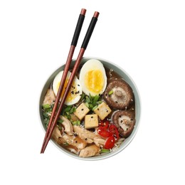 Bowl of delicious ramen and chopsticks isolated on white, top view. Noodle soup