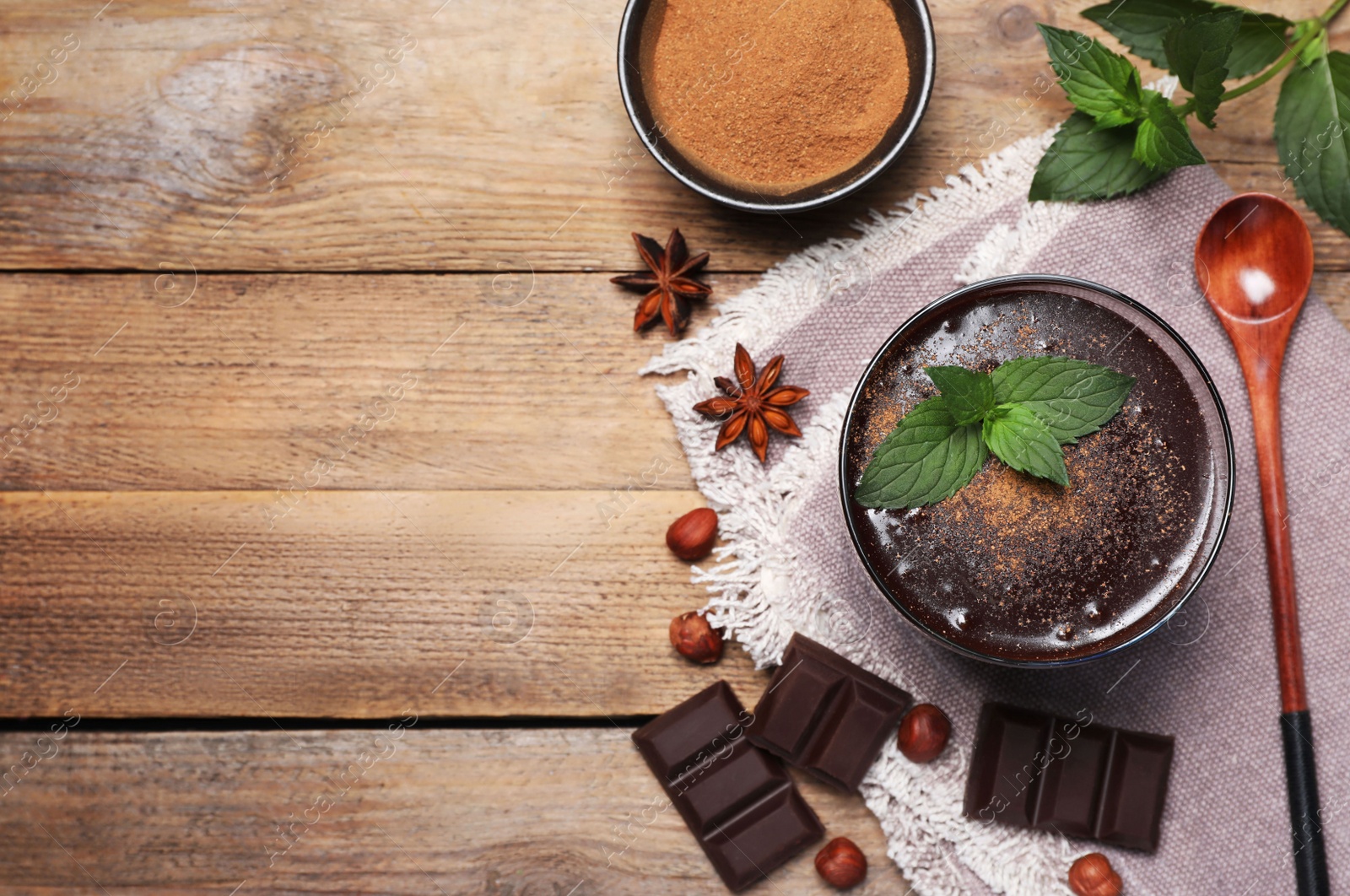 Photo of Flat lay composition with glass of delicious hot chocolate and fresh mint on wooden table. Space for text