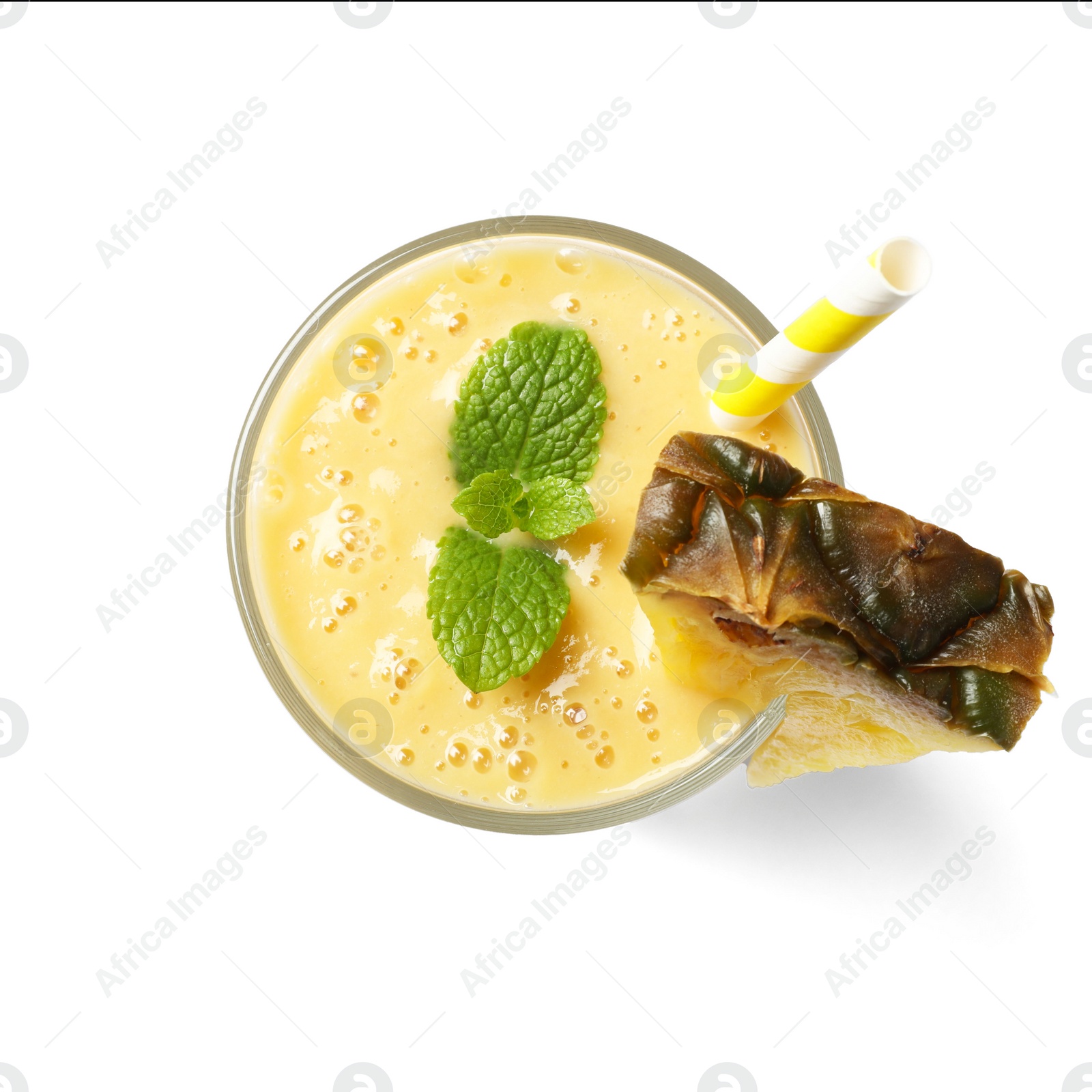 Photo of Glass of tasty pineapple smoothie isolated on white, top view