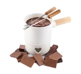 Photo of Fondue pot with melted chocolate, forks and pieces of chocolate bar isolated on white