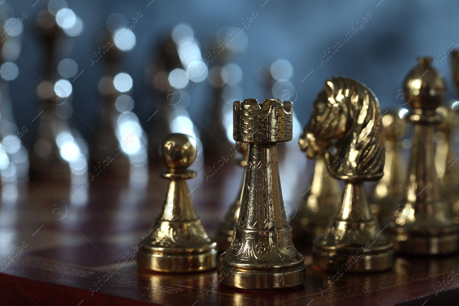 Photo of Chess pieces on checkerboard, selective focus. Space for text