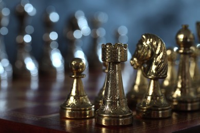 Chess pieces on checkerboard, selective focus. Space for text