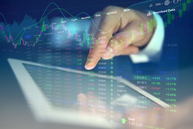 Image of Stock exchange. Man using tablet and illustration of rating graph