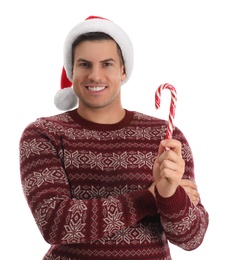 Photo of Handsome man in Santa hat holding candy cane on white background
