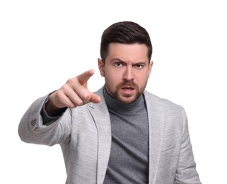 Emotional businessman in suit pointing at something on white background