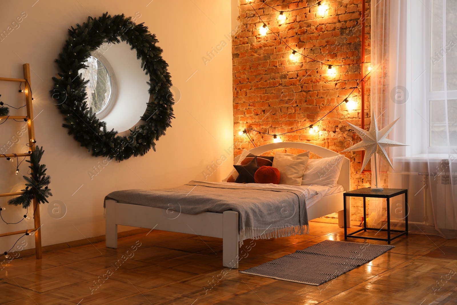 Photo of Cozy bedroom with stylish Christmas decor. Interior design