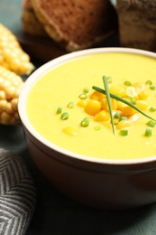 Photo of Delicious creamy corn soup on table, closeup