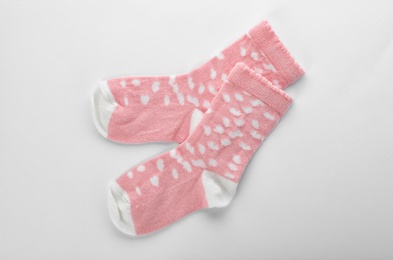 Cute child socks on white background, top view