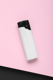 Stylish small pocket lighter on color background, top view