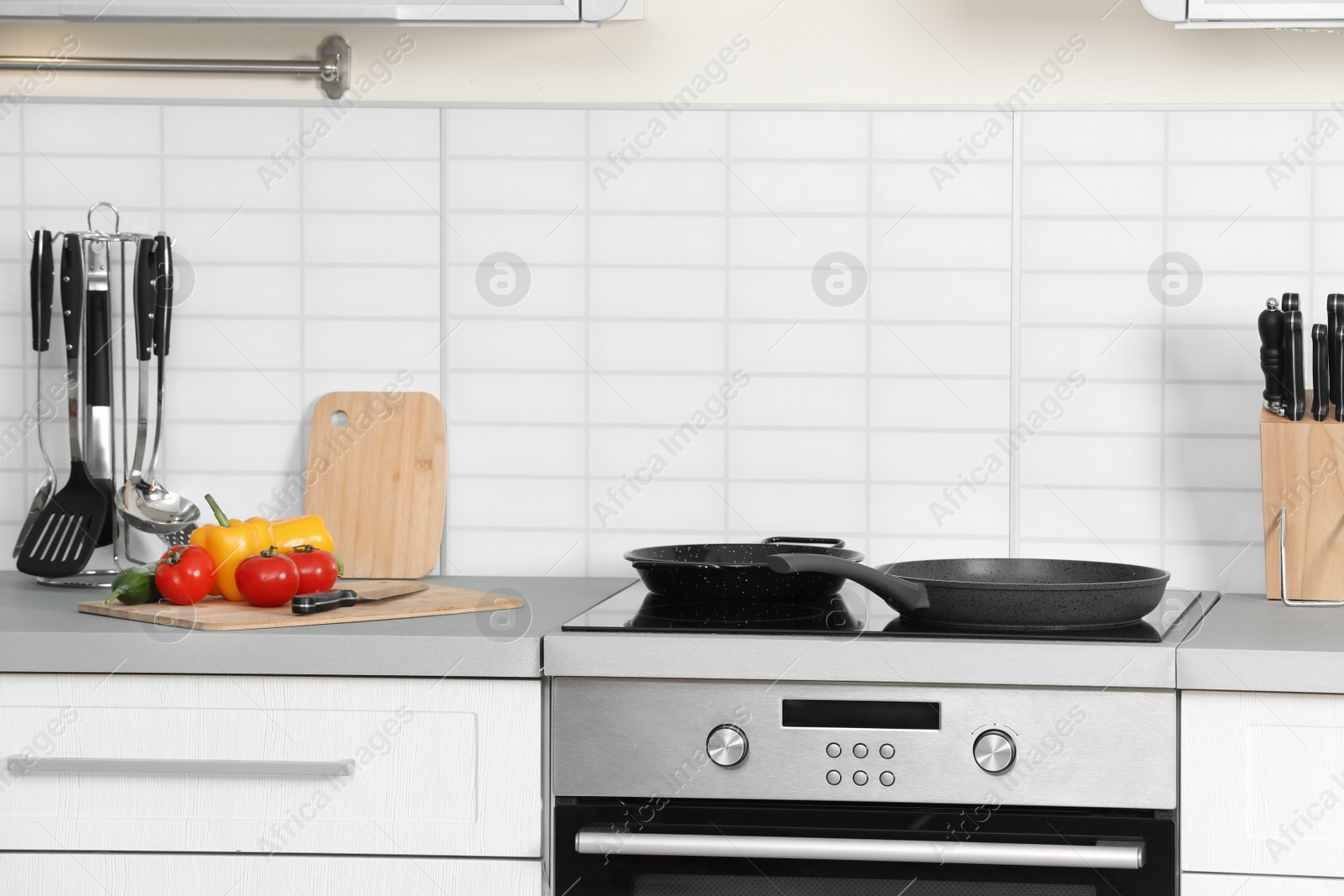 Photo of Set of clean cookware and utensils on table in kitchen. Space for text