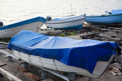 Moored boats on beach near sea outdoors