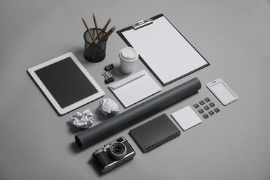 Composition with stationery on grey background. Mock up for design