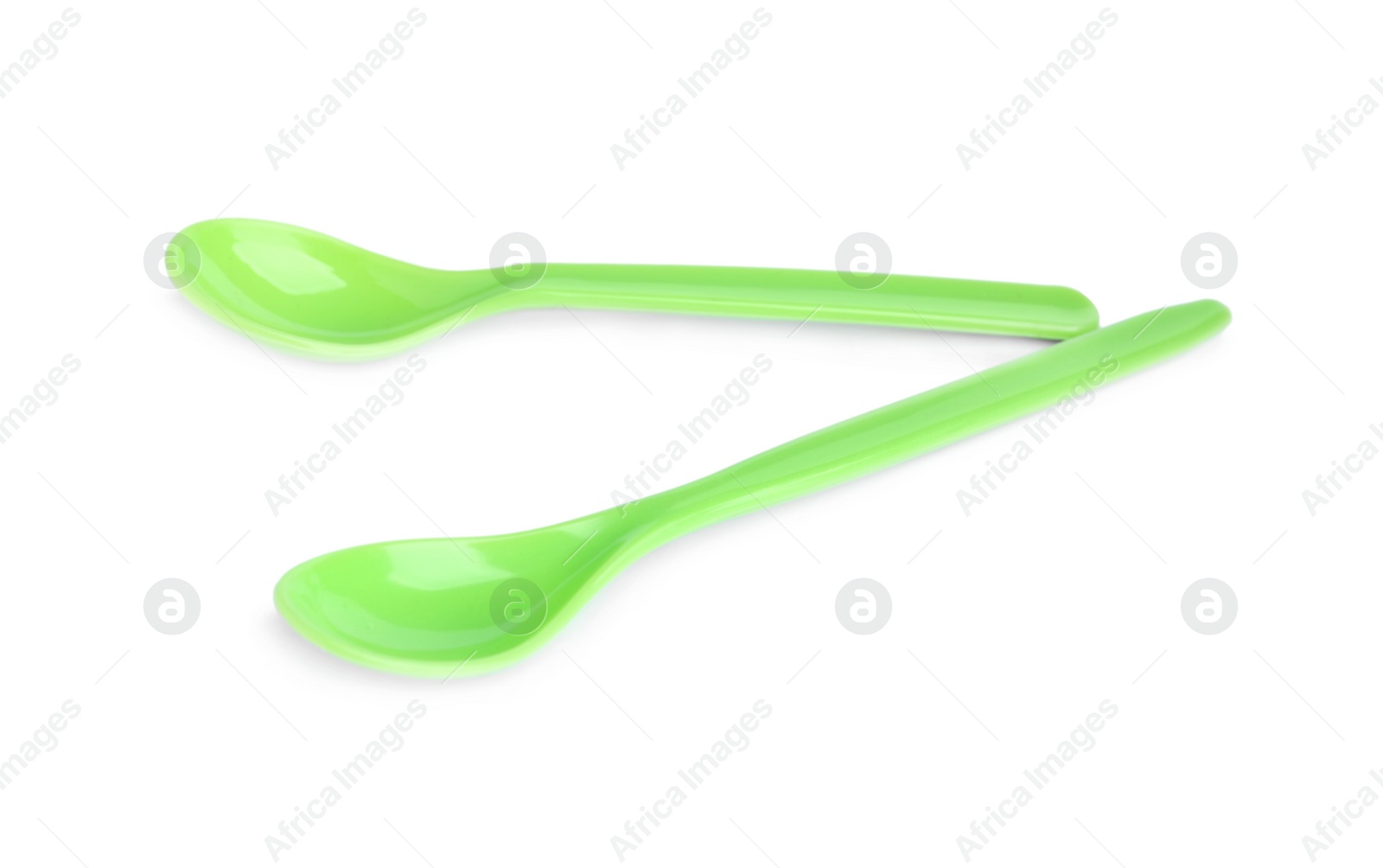 Photo of Small plastic spoons isolated on white. Serving baby food