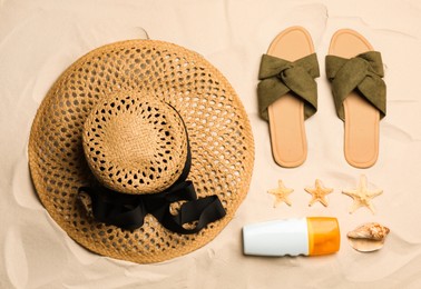 Flat lay composition with beach objects on sand