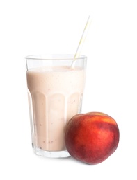 Photo of Tasty peach milk shake and fresh fruit isolated on white