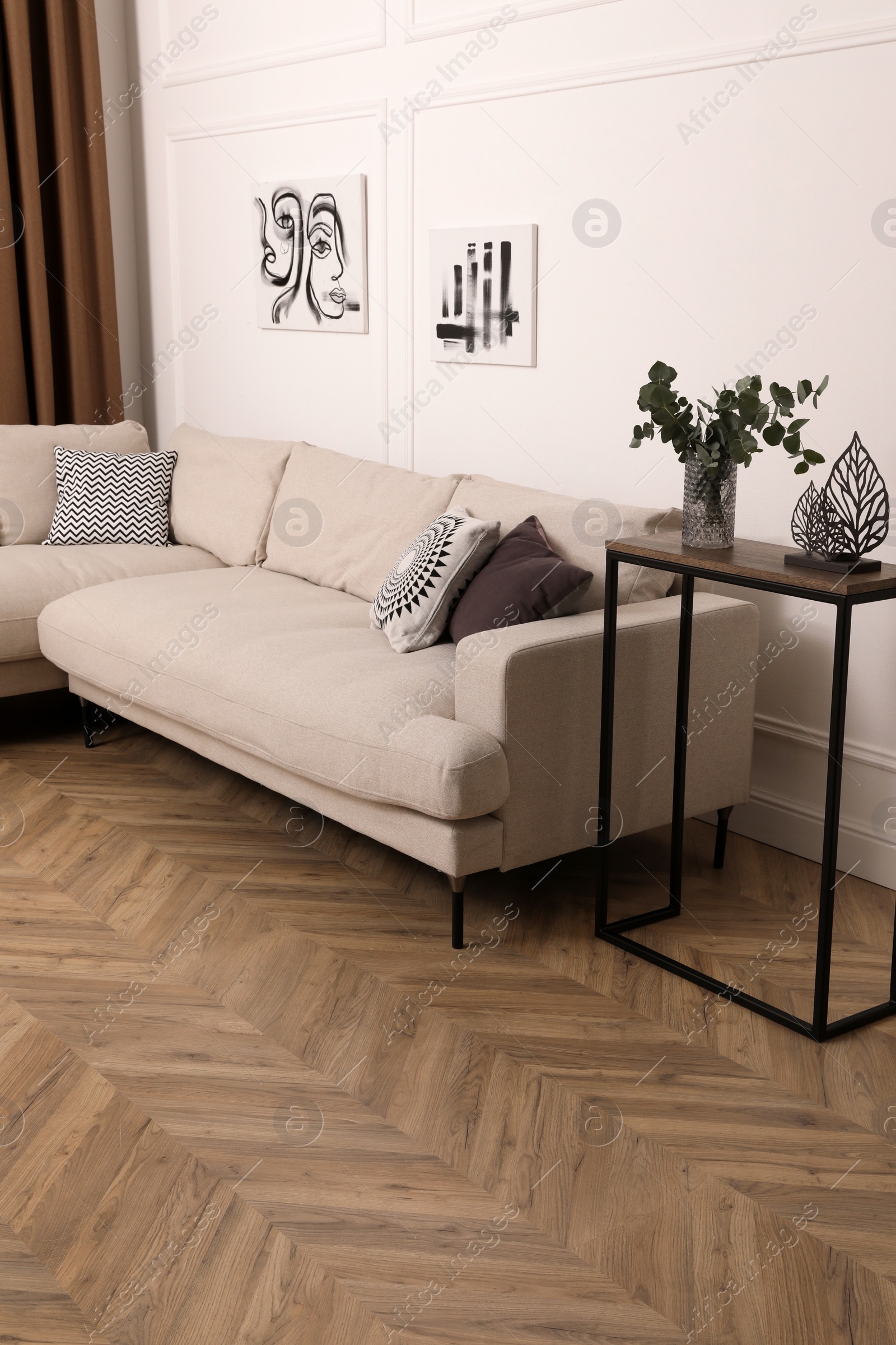 Photo of Modern living room with parquet flooring and stylish furniture