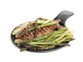 Photo of Tasty grilled meat with asparagus isolated on white