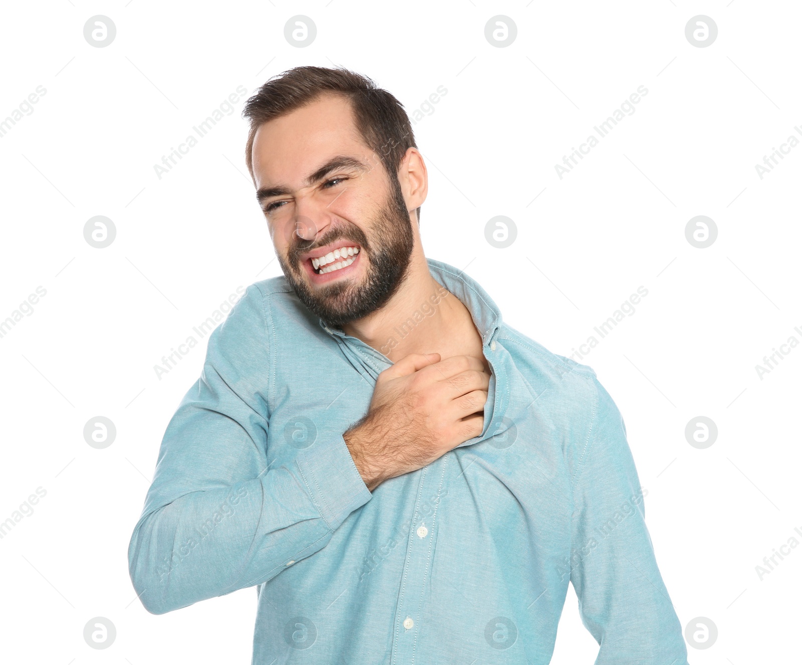 Photo of Young man scratching skin on white background. Annoying itch