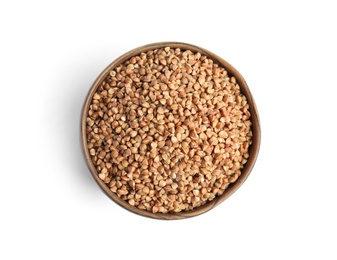 Photo of Bowl with uncooked buckwheat on white background, top view