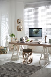 Stylish home office interior with comfortable workplace