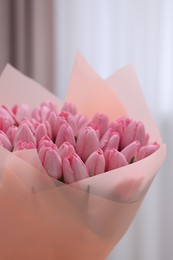 Bouquet of beautiful pink tulips on blurred background, closeup