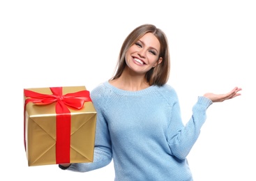 Photo of Young woman with Christmas gift on white background
