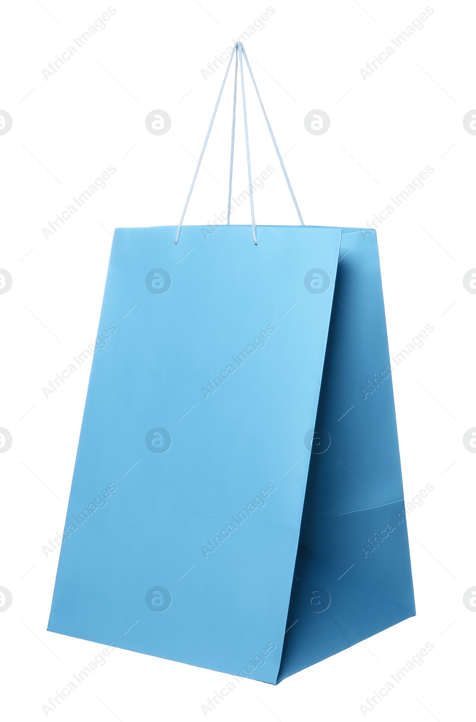 Photo of One light blue shopping bag isolated on white