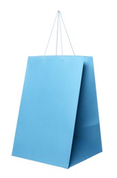 One light blue shopping bag isolated on white