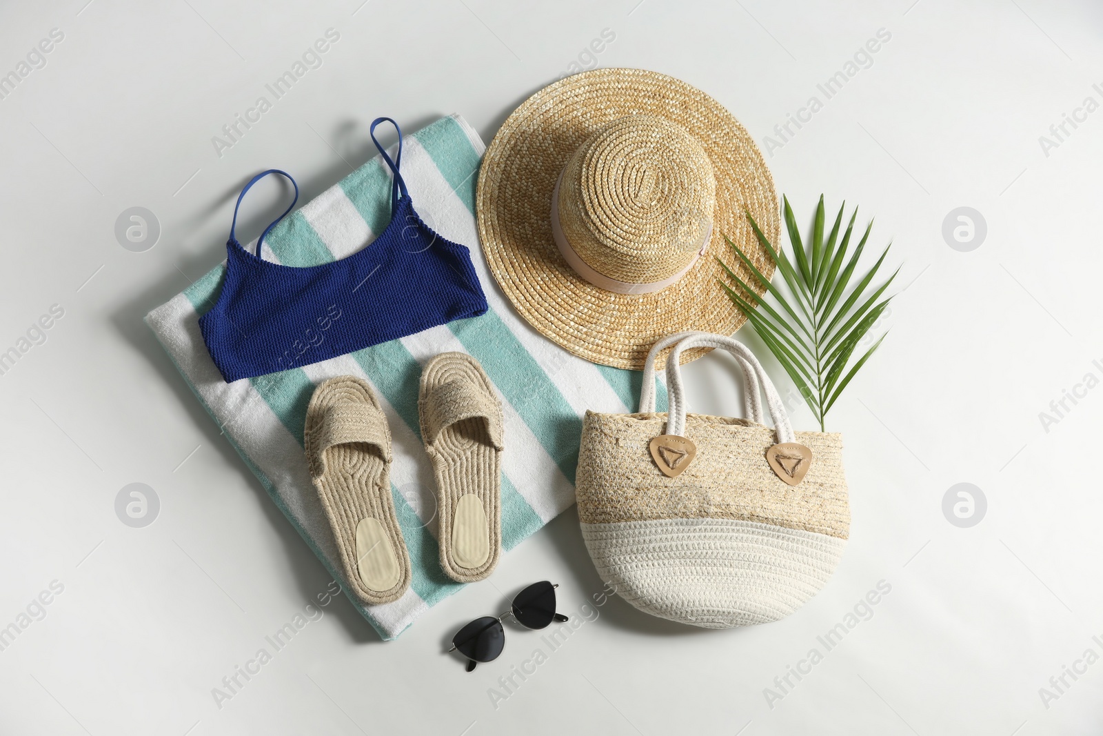 Photo of Composition with stylish beach accessories on white background, top view